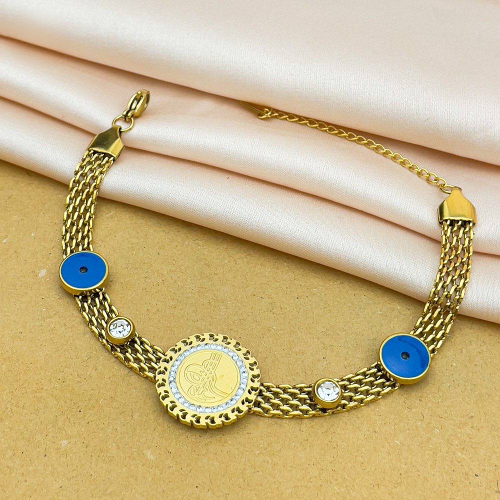 Gold Coin & Twin Blue Eye Charm Bracelet