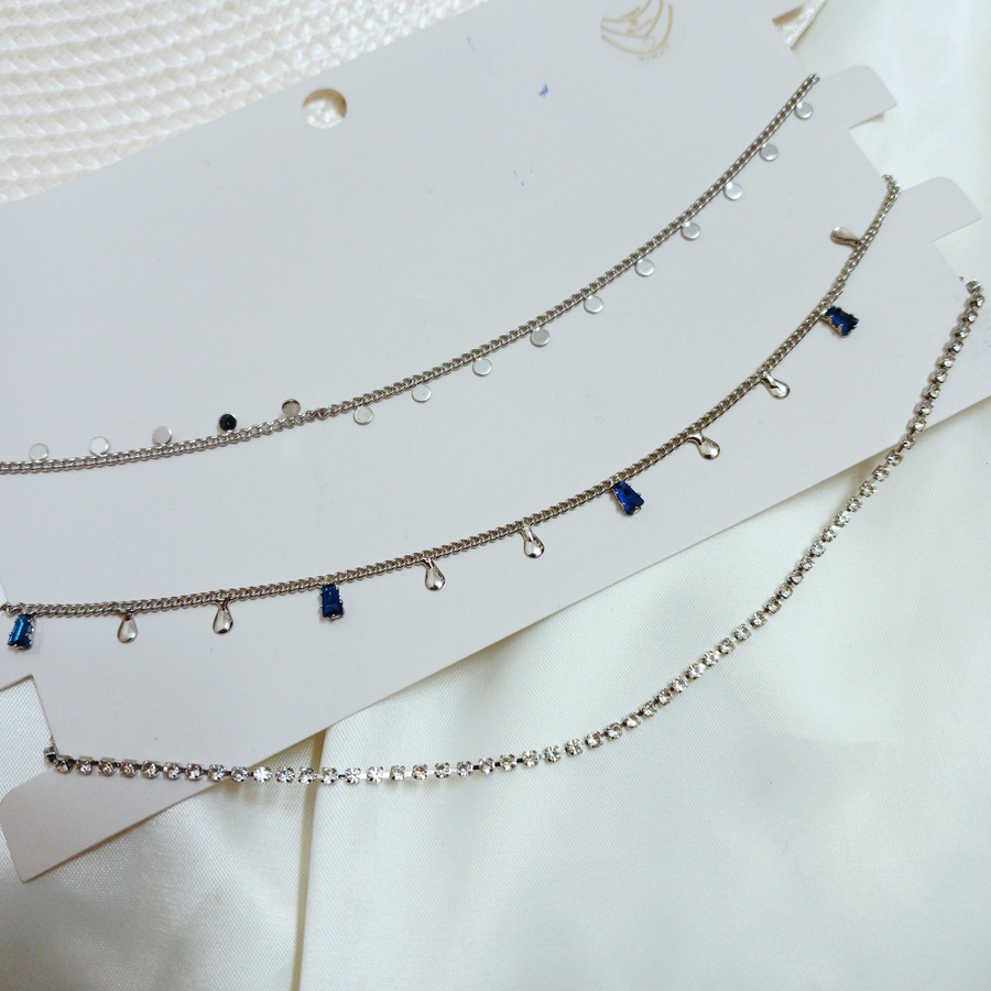 Silver choker of multi layers with blue stones