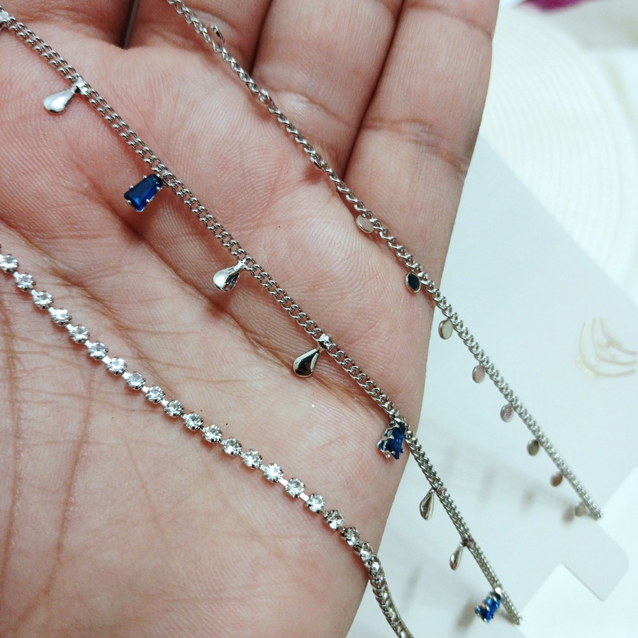 Silver choker of multi layers with blue stones