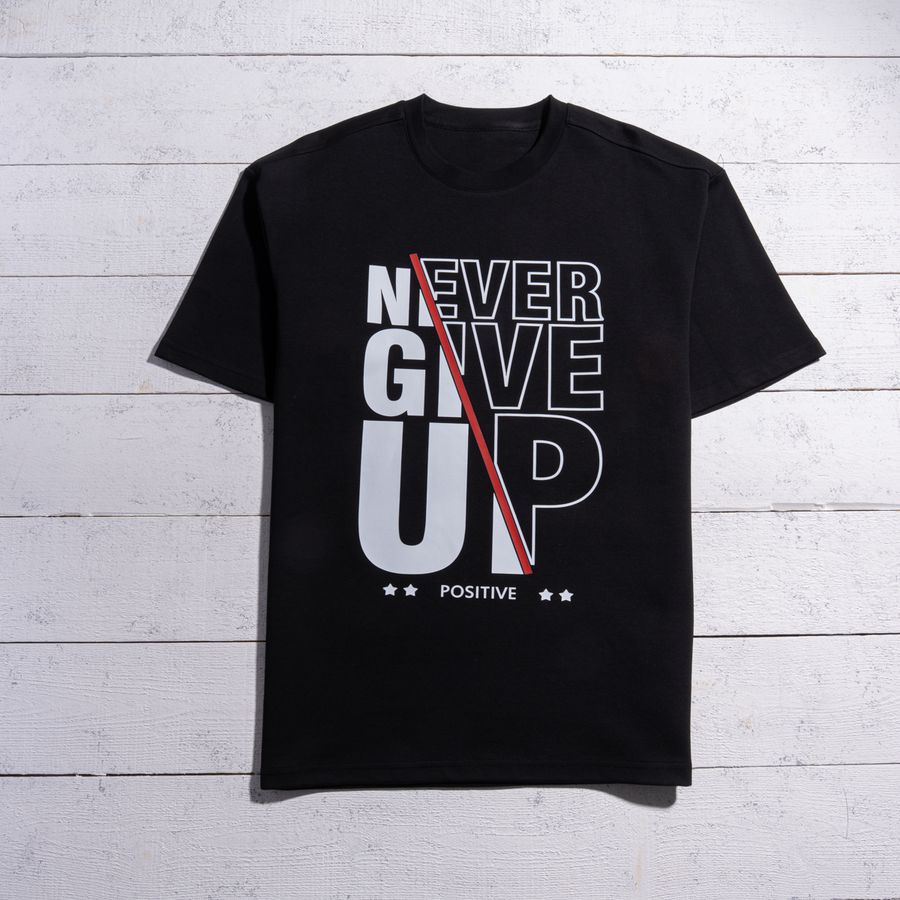 تيشرت NEVER GIVE UP أوفر سايز | قطن أنترلوك 100% للجنسين