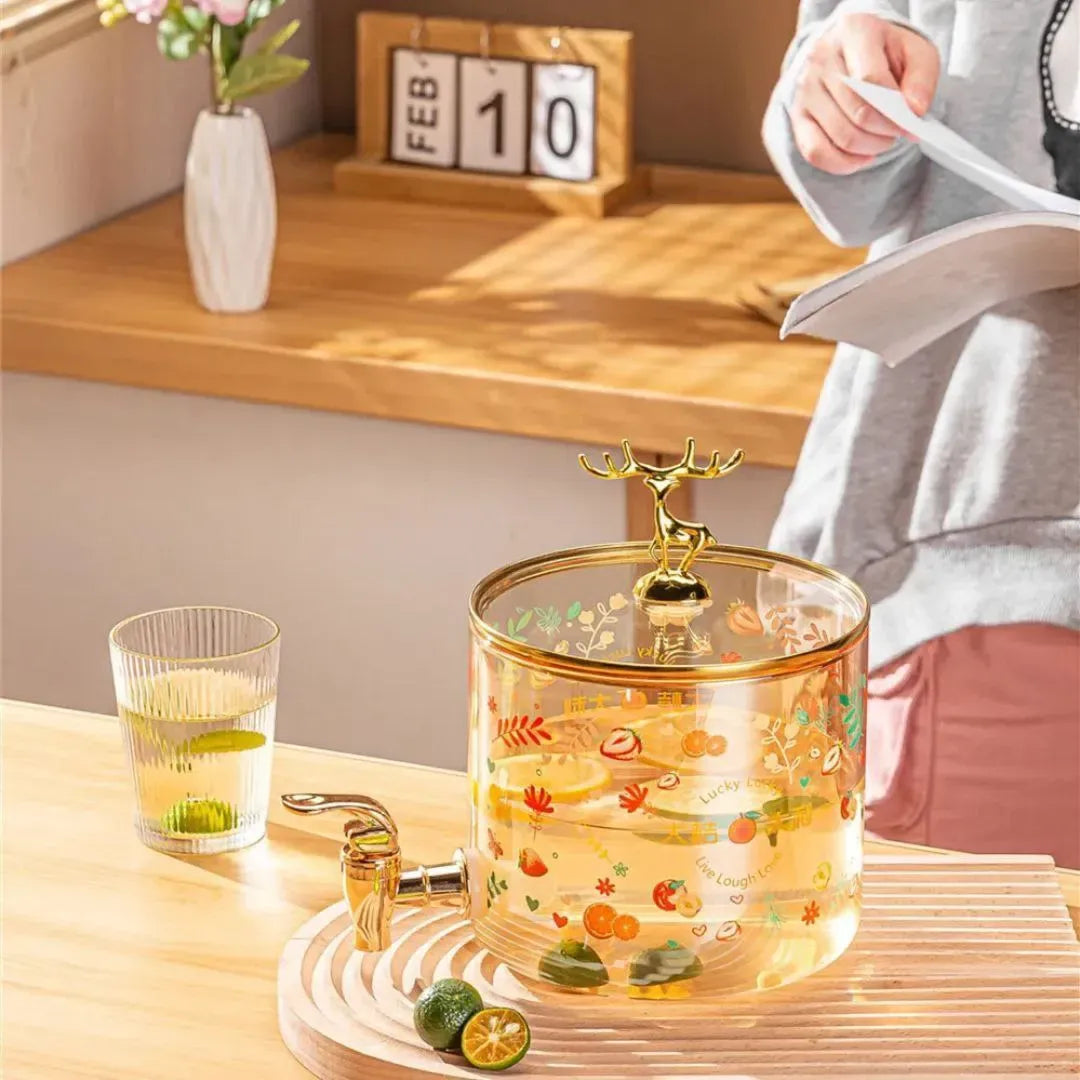  ديسبنسر عصائر زجاجي فاخر بقاعدة خشبية وغطاء الغزال الذهبي . Deer Juice Dispenser