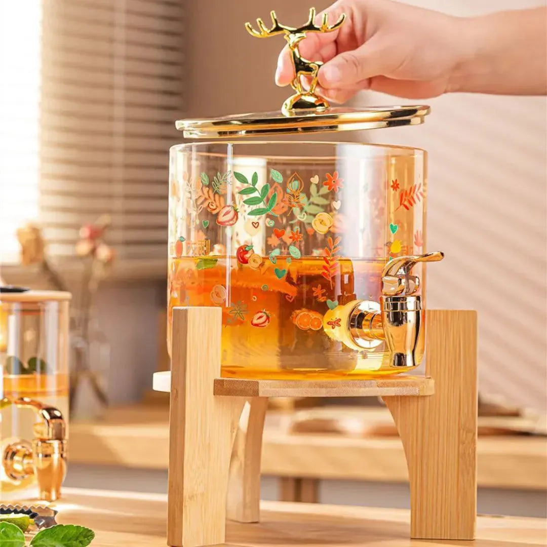  ديسبنسر عصائر زجاجي فاخر بقاعدة خشبية وغطاء الغزال الذهبي . Deer Juice Dispenser
