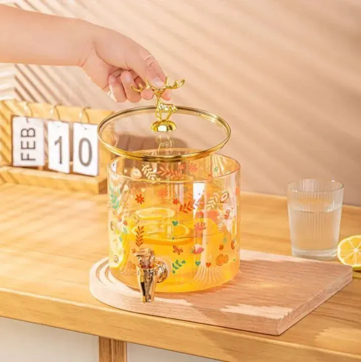  ديسبنسر عصائر زجاجي فاخر بقاعدة خشبية وغطاء الغزال الذهبي . Deer Juice Dispenser
