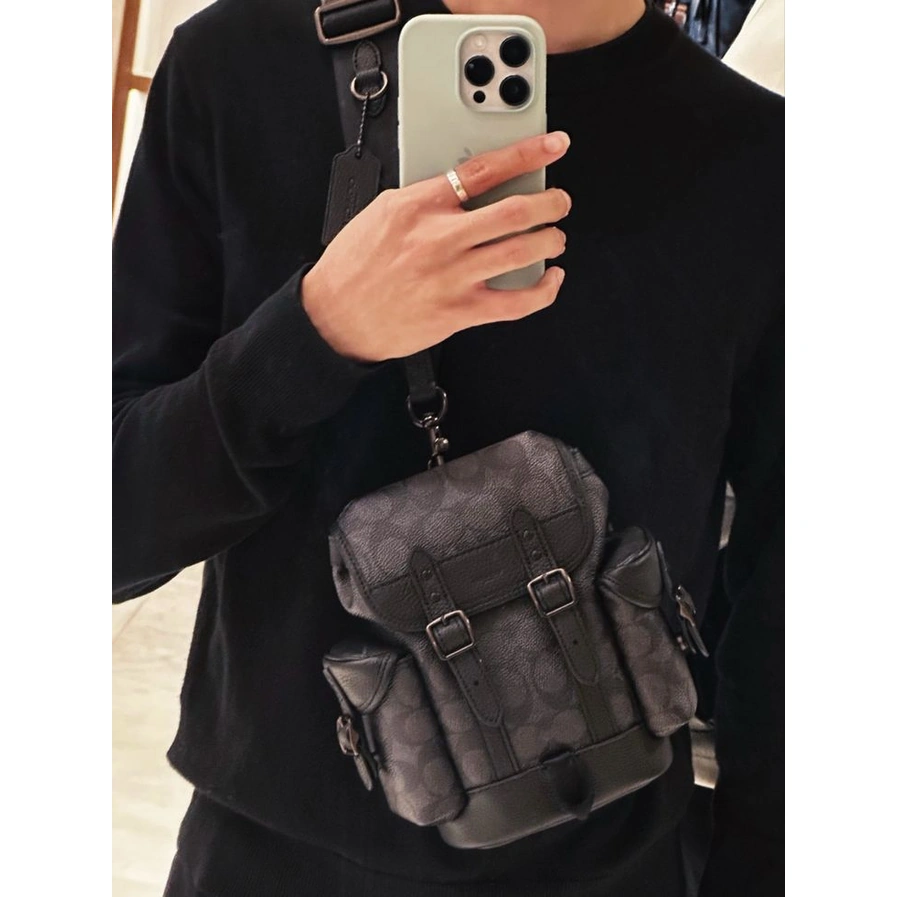 Elevate your everyday carry with the Coach Sling Bag – Unisex Design, now available in a curated range of sophisticated dark tones #0058