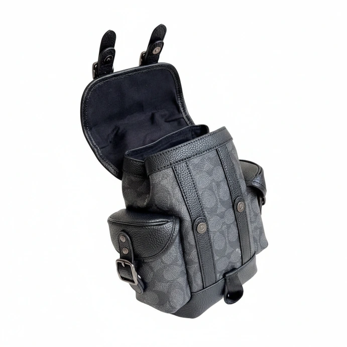 Redefine your daily commute with the Coach Signature Unisex Sling Bag #0057