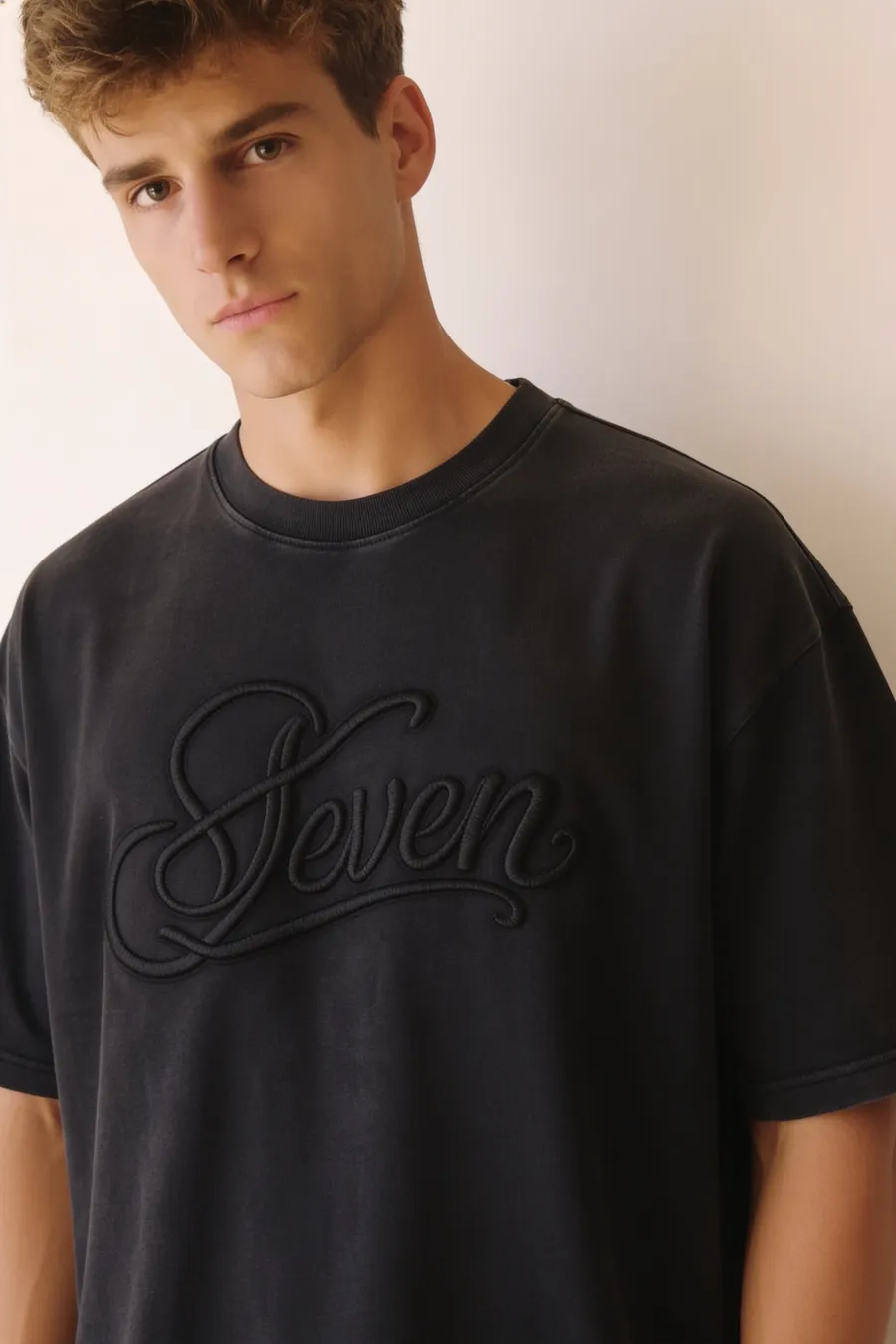 Washed black embossed seven Tshirt