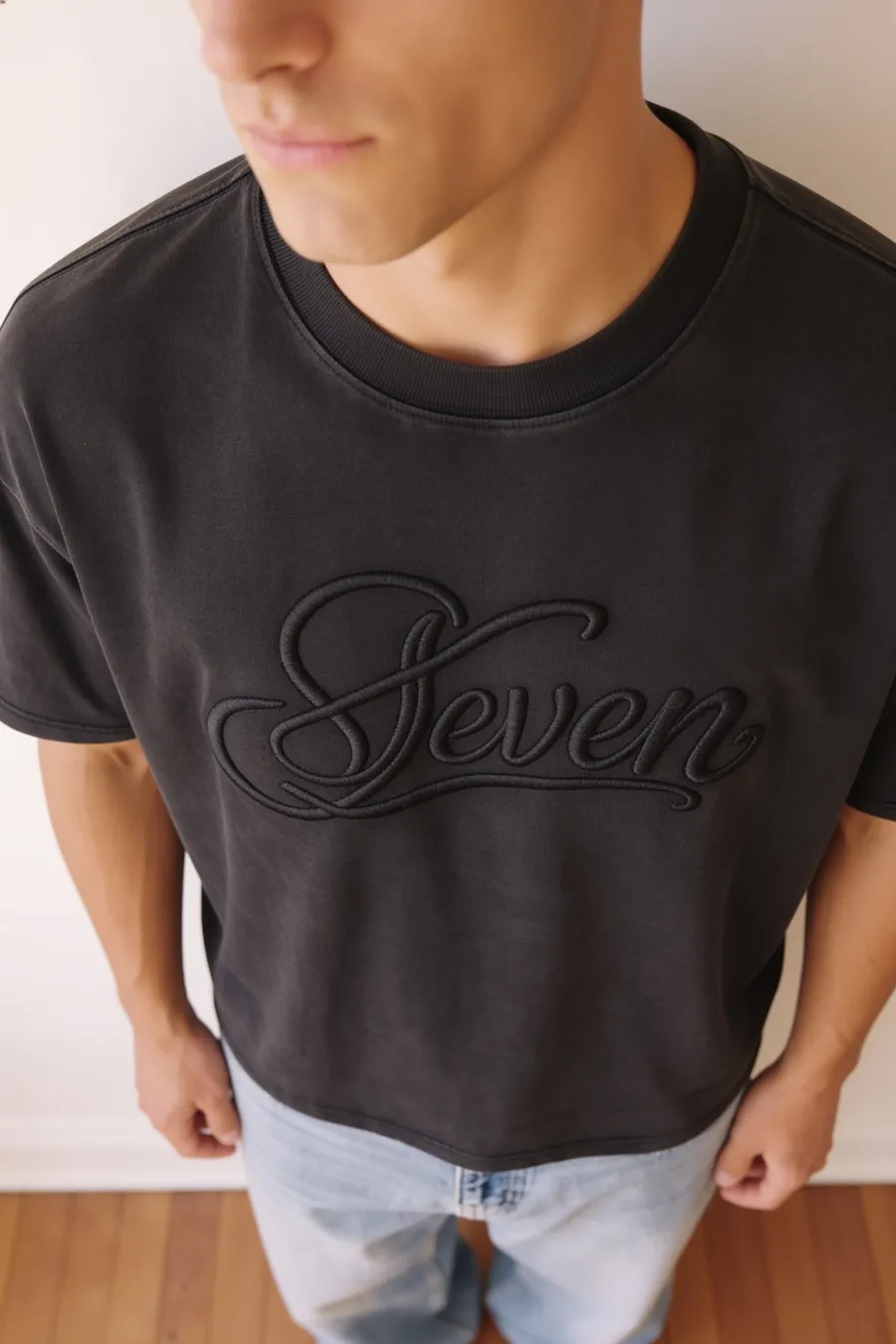 Washed black embossed seven Tshirt
